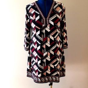 Excellent condition, XL, v-neck tunic style dress. Beautiful mauve print.